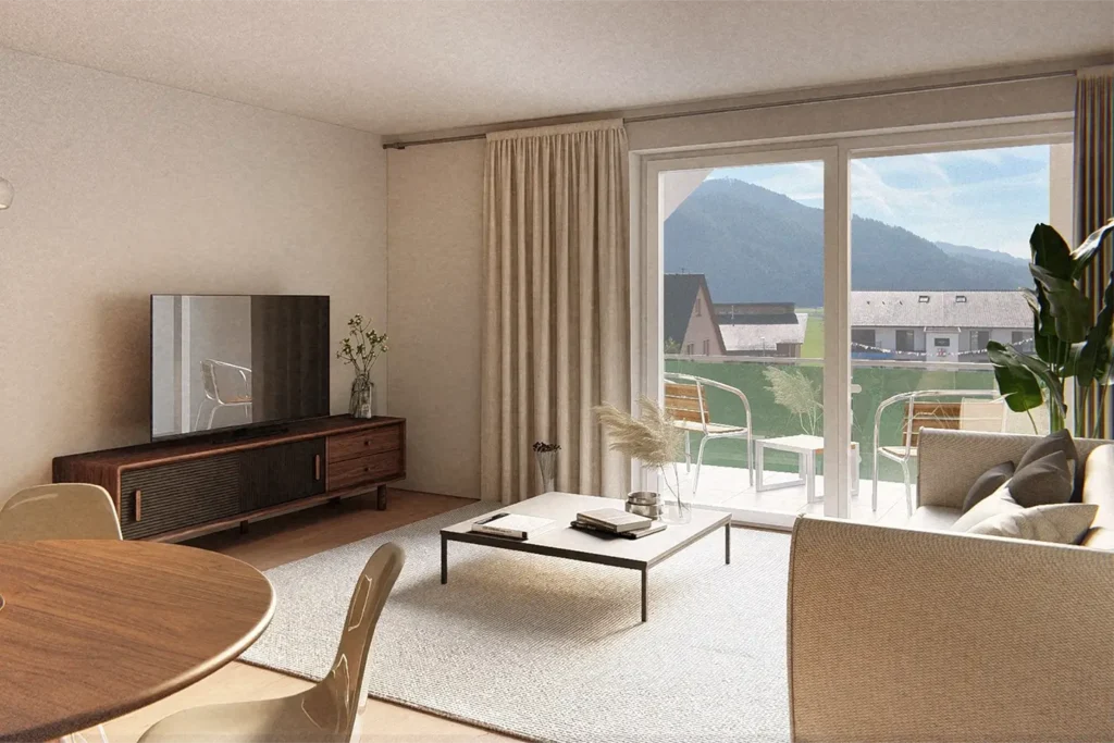 Helles Wohnzimmer einer modernen Wohnung in Fischerbach mit großem Fenster, gemütlicher Sitzecke, Holz-Esstisch und Zugang zu einem Balkon mit Blick auf die Berge.